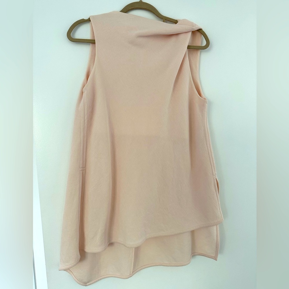 Top light pink/cream color, structured style